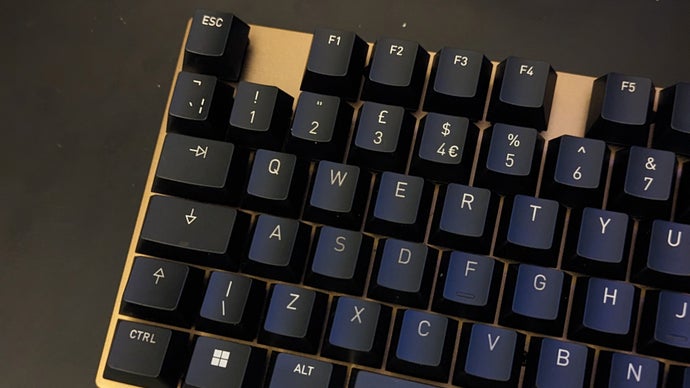 a cherry kc 200 mx keyboard with an 's' key with lettering that looks slightly darker than that of the other keycaps