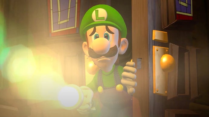 A scared-looking Luigi shines a torch at the viewer.
