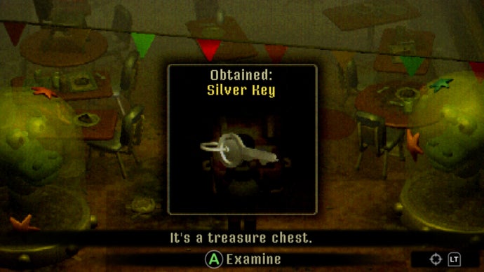 Mara's obtained a silver key. It was removed from a treasure chest, which you can see peeking out below the pop-up screen.