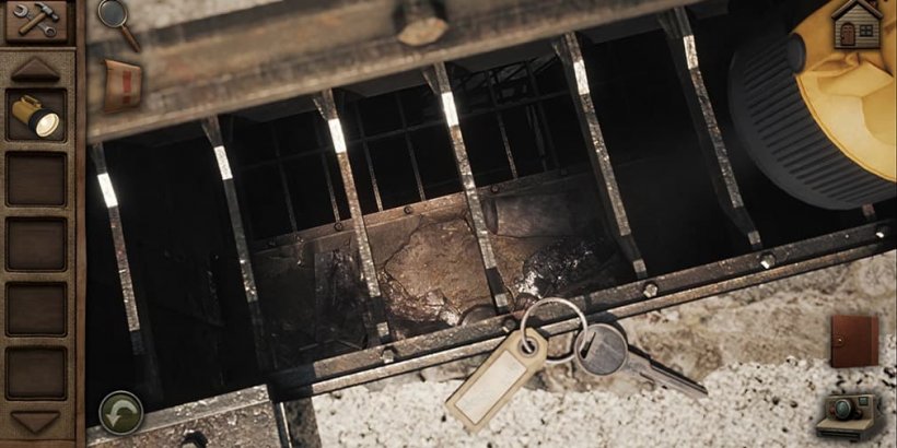 A yellow flashlight lighting up a drain. Next to the drain is a key on a keyring.