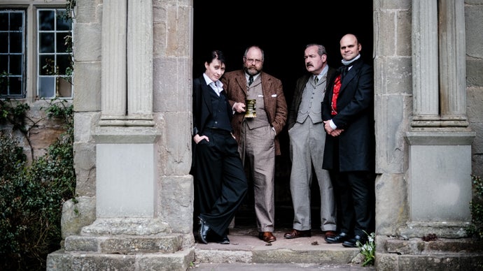 Key of Dreams photo showing four actors in vintage formal clothing.