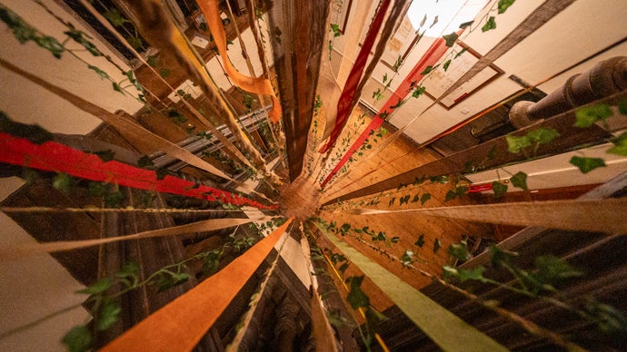 Key of Dreams photo showing a downwards view from a staircase, with fabric falling down the stairwell.