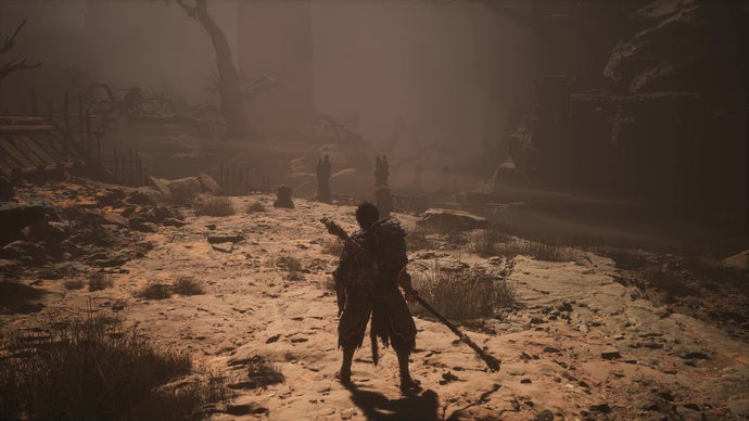 A monkey warrior stands in a dusty ravine in Black Myth: Wukong