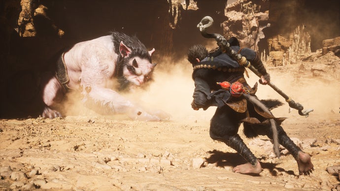 A monkey warrior runs toward a large rat monster in Black Myth: Wukong.