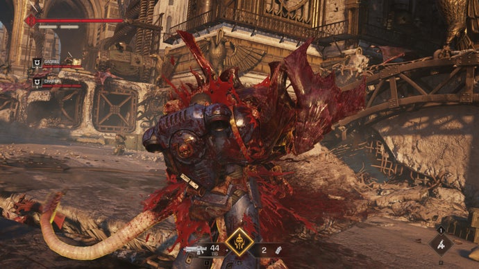 A screenshot of Warhammer 40,000: Space Marine 2, showing Titus stabbing a Tyranid in the gut.