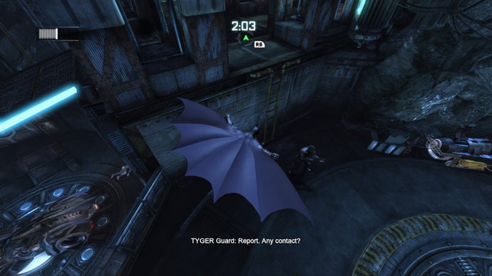 Batman swoops through the Batcave, cape billowing in this screen from Batman Arkham City. Text reads "TYGER GUARD: Report. Any contact?"