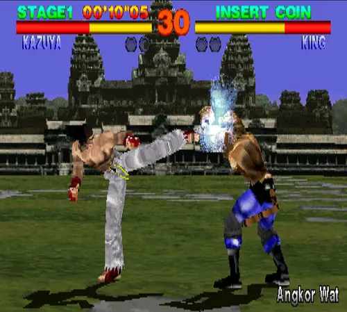 Tekken 1 screenshot showing Kazyua fighting King, landing a kick to his face on the Angkor Wat arena