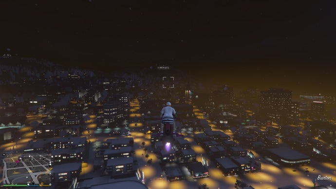 Flying over a snowy Los Santos in GTA Online.