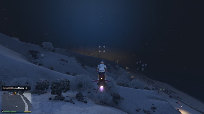 Flying over a dark snowy hillside in GTA Online.