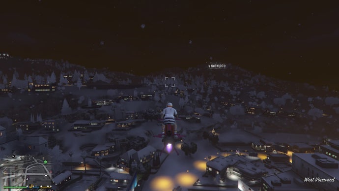 Flying towards a snowy Vineland sign in GTA Online.