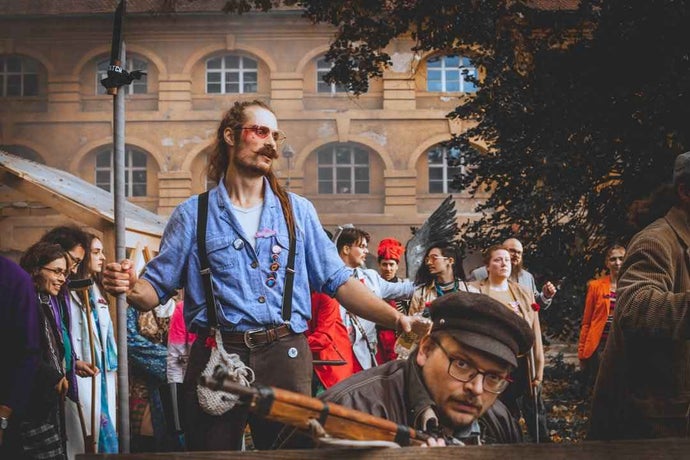 A group of costumed performers at a Disco Elysium LARP.