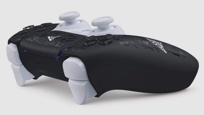 An image of The Last of Us limited edition DualSense controller viewed from the rear, featuring a black and white colour scheme with "glossy trophy icons" printed across the surface.