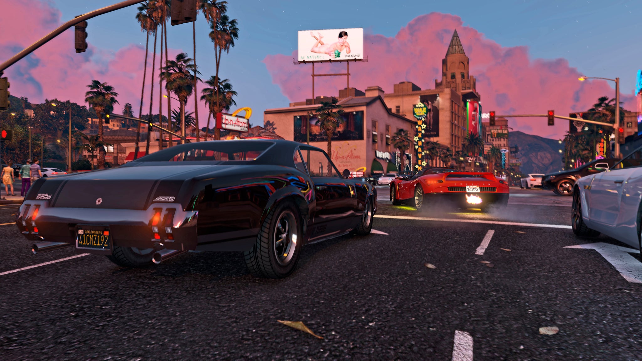 Official GTA 5 image showing a black muscle car at a busy junction