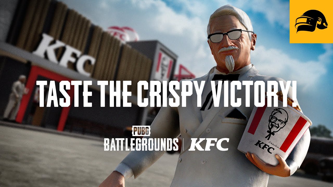 A picture of KFC's Colonel Sanders holding a bucket of KFC chicken in front of a KFC restaurant in the game PUBG. The text says "Taste The Crispy Victory".